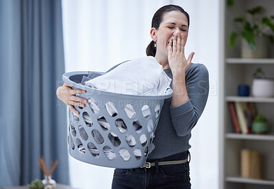 Buy stock photo Tired, yawning and woman with laundry basket in home feeling stress, burnout and fatigue from spring cleaning, washing clothes and chores. Exhausted sleepy female covering mouth from bored housework