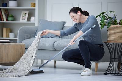 Buy stock photo Woman, cleaning home and with broom sweeping carpet for daily chores, cleanliness and doing housework. Cleaner, domestic and lady complete duties, clean under mat for dust, health and hygiene