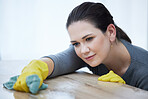 Cleaning, table and woman with cloth focus on washing furniture dust, dirt or bacteria for clean home, house or apartment. Housekeeping service cleaner working on desk surface with liquid soap water