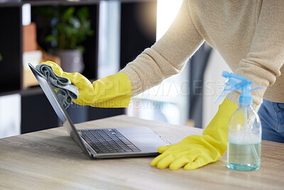Buy stock photo Laptop, cleaning and hands with an office cleaner wiping a computer on a desk or table with sanitizer. Hygiene, disinfectant and rubber gloves with a woman dusting or washing wireless technology