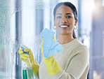 Cleaning, window and water with a black woman washing a glass pane in a home while sanitizing for housework. Portrait, room and apartment with a young female wiping a transparent surface with a cloth