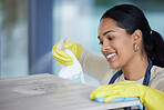 Clean, woman cleaning office with soap detergent product and cloth to disinfect space from dust and germs. Happy, cleaner service, housekeeper, safety gloves and hygiene sanitation of workspace.