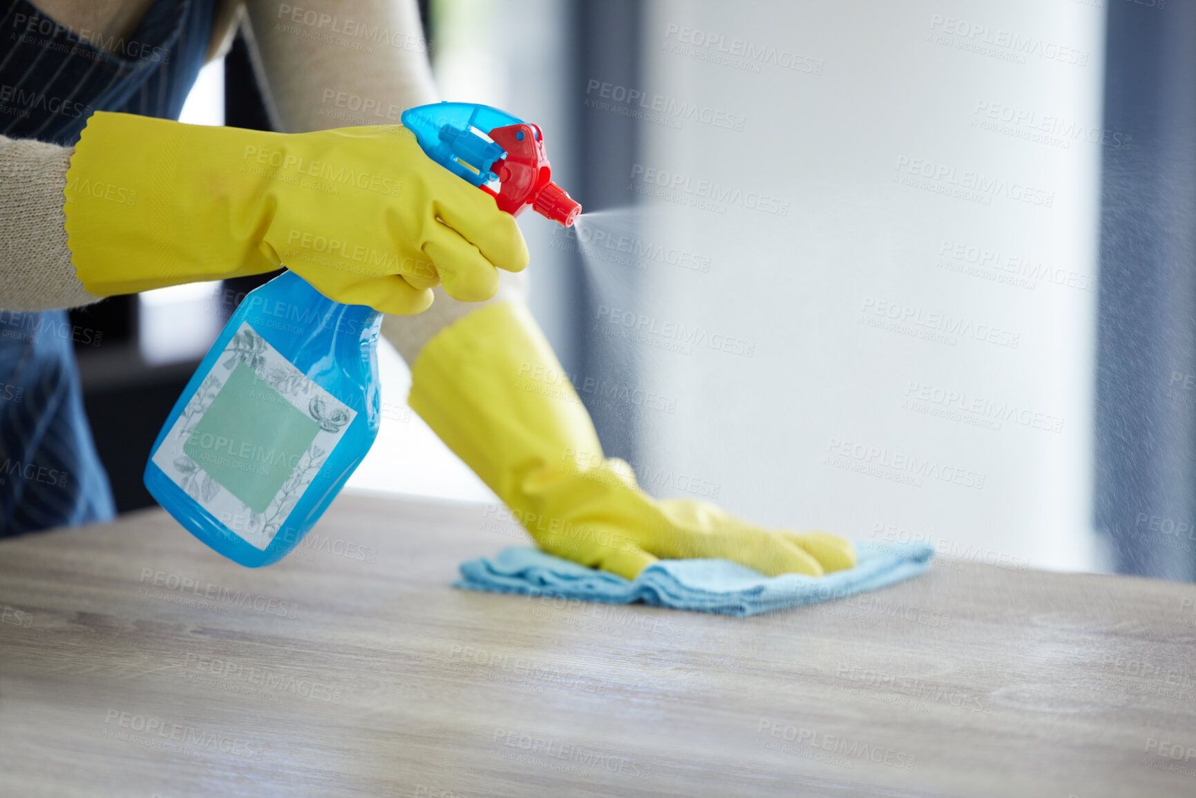 Buy stock photo Hands, spray bottle or cleaning cloth on house, home or office wood desk or table in germs, virus or bacteria maintenance. Zoom, woman or housekeeping cleaner service with product container or gloves