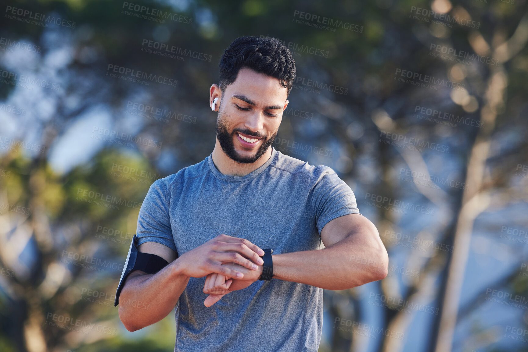 Buy stock photo Runner with fitness smart watch, app and check running time for health tracking tech on nature run. Sports athlete doing workout practice for cardio wellness, physical fitness and marathon training 