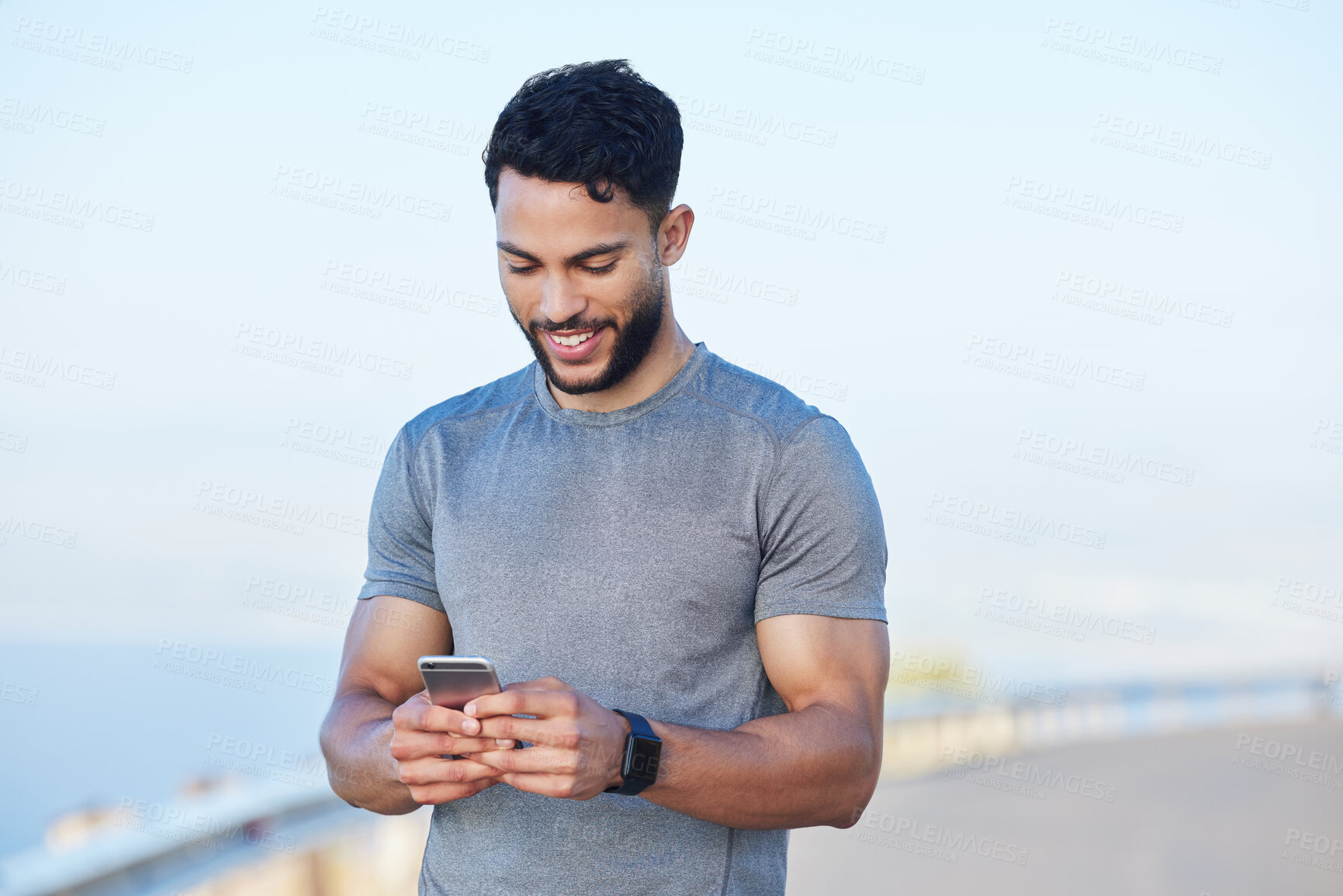 Buy stock photo Phone, fitness and app with a sports man tracking his progress online with 5g mobile technology. Exercise, training and workout with a male athlete posting his personal performance to social media