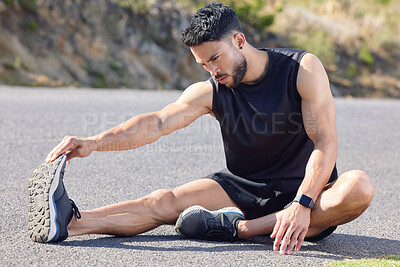 Buy stock photo Fitness, exercise and stretching with a sports man preparing for a workout or cardio training on a road in nature. Health, wellness and performance with a male athlete at the start of a routine