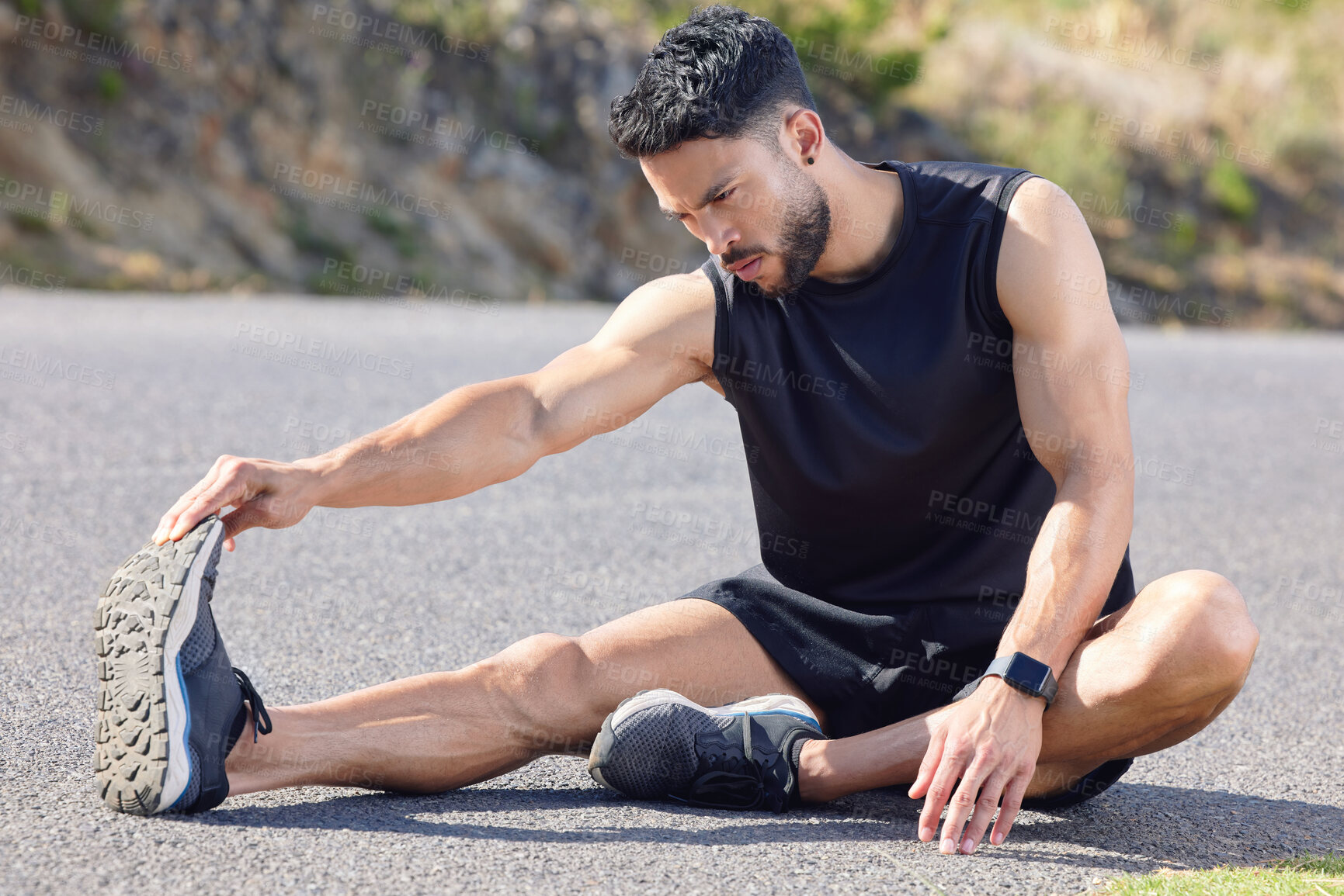 Buy stock photo Fitness, exercise and stretching with a sports man preparing for a workout or cardio training on a road in nature. Health, wellness and performance with a male athlete at the start of a routine