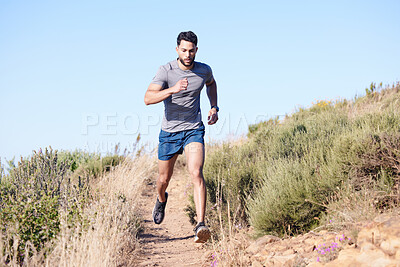 Buy stock photo Fitness, mountain and man running in nature for exercise, cardio health and body goal. Strong athlete runner with focus during workout and training for wellness on a path in the countryside 