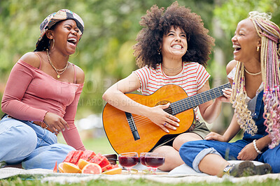 Buy stock photo Friends, picnic in nature with guitar and smile or laugh as woman play music instrument. Black woman relax, happy together on grass of nature park and eat healthy organic fruit lunch with wine drink 