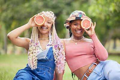 Buy stock photo Grapefruit, smile and friends on a picnic in a park in Australia during summer. Portrait of happy African women on a diet for health with fruit, nutrition and food to detox together in nature 