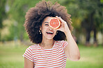 Woman, happy and diet with grapefruit for healthy detox and body in a nature park in summer. Portrait of female skincare and wellness beauty routine keeps her body fresh or wellness outdoor in summer