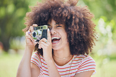 Buy stock photo Photographer, happy and woman with a camera in nature enjoying taking pictures of a natural environment. Smile, happiness and Afro girl outdoors shooting creative shots as a freelancer in photography