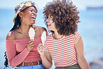 Beach, ice cream and friends on holiday laughing at a funny joke while bonding, happy and relaxing with freedom outdoors. Smile, happiness and young girls eating icecream at sea for a summer vacation