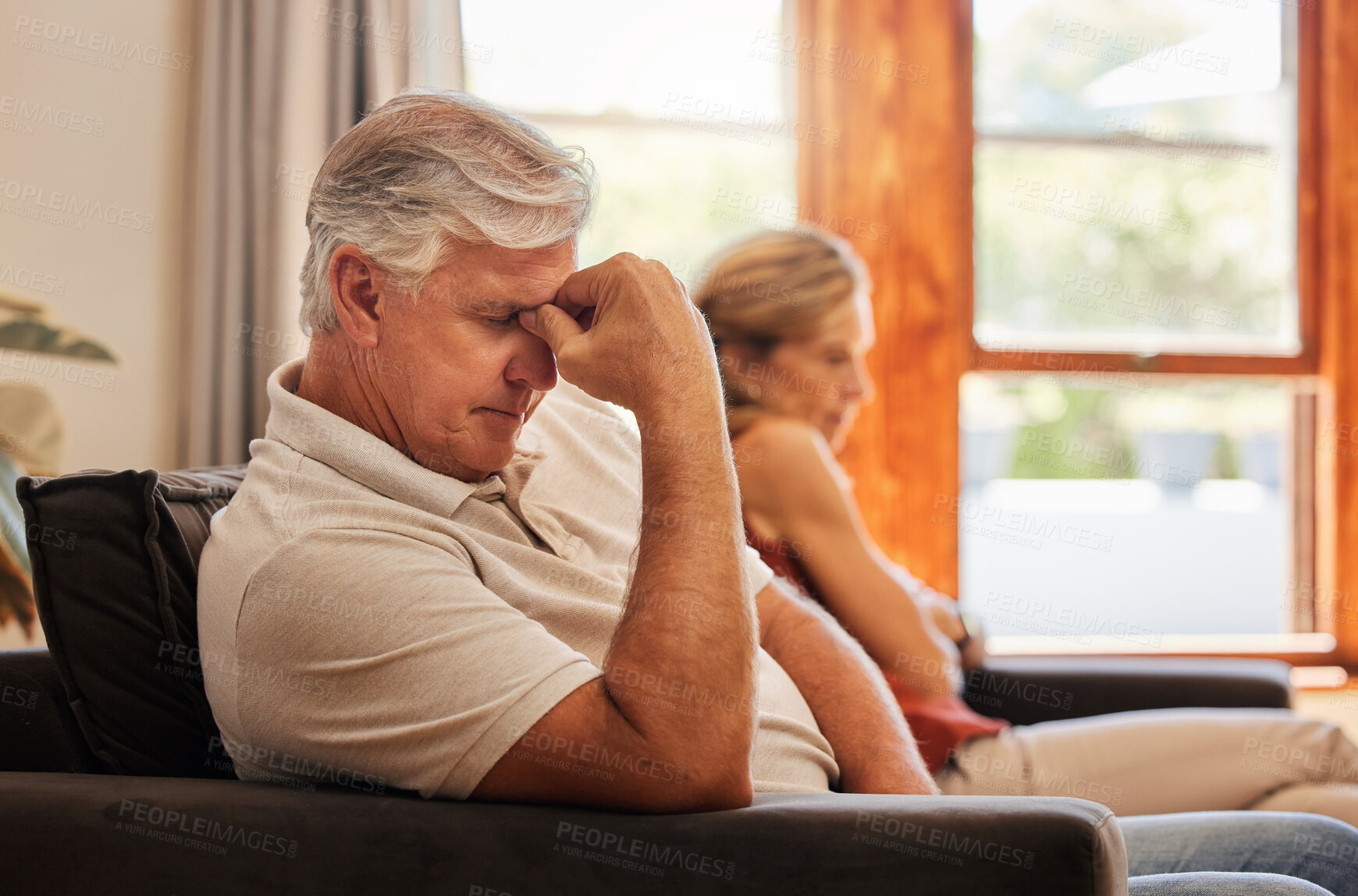 Buy stock photo Stress, divorce and old couple in living room after a fight, argument and conflict in the marriage at home. Sad, frustrated woman with a worried and tired partner on the sofa thinking of a breakup