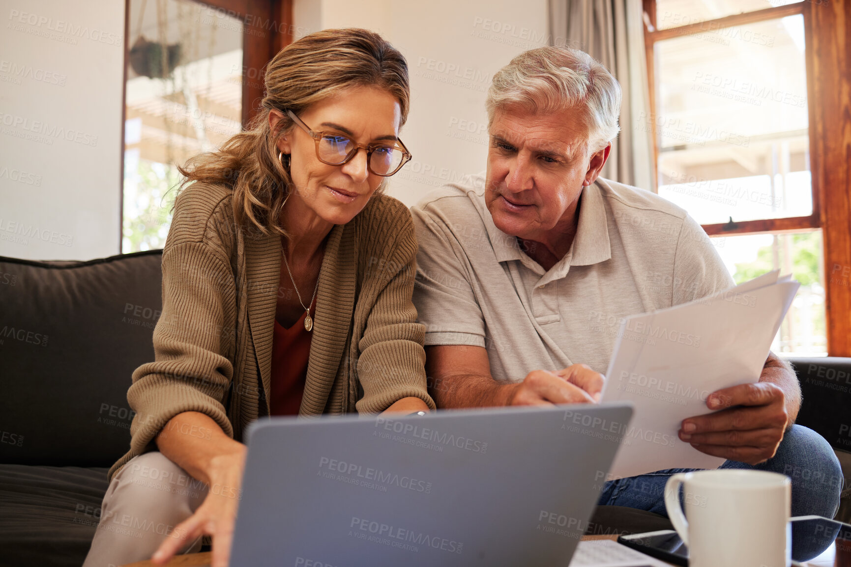 Buy stock photo Retirement couple budget, finance and investment planning, loan and paper bills with laptop technology in home. Mature people money, cash savings or legal insurance document report on online bank
