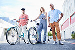 Bicycle, skateboard and portrait of friends in city on summer vacation together in South Africa. Trendy, fashion and cool hipster people standing in urban road on fun adventure, journey or holiday.