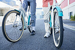 Bicycle, city and couple legs for street exercise or travel in an urban town together for an outdoor adventure. Cycle wheels for tour of people or cycling tourists on a bike in a town in South Africa
