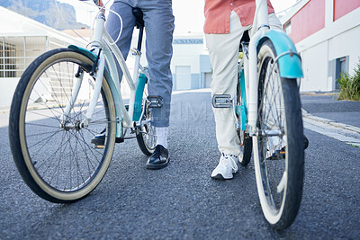 Buy stock photo Bicycle, city and couple legs for street exercise or travel in an urban town together for an outdoor adventure. Cycle wheels for tour of people or cycling tourists on a bike in a town in South Africa