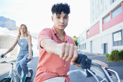Buy stock photo Bike, travel and friends with a man and woman riding a bicycle together in the city during summer. Sport, cycling and carbon footprint with a young male and female friend biking in an urban town