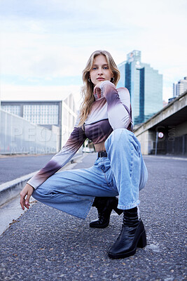 Buy stock photo Fashion, beauty and city with a woman or model posing on the road and street on an urban background. Style, edgy and trendy with a young female in contemporary clothes outdoor for a summer catalog
