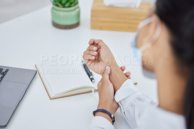 Buy stock photo Hand, pain and business person with injury from burnout, stress and writing in notebook at a desk at work. Corporate employee and worker with face mask for covid and medical arthritis problem