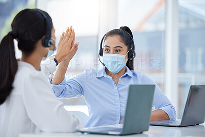 Buy stock photo Covid face mask, high five and call center women in customer service laptop support, telemarketing success and b2b sales. Contact us, receptionist or consultants on office tech in covid 19 compliance