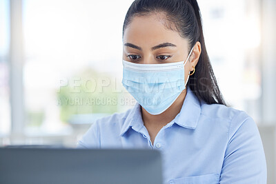 Buy stock photo Covid, laptop and business woman typing an email on the internet in office at work. Corporate manager, employee or worker reading a proposal and working on the internet at a company with a face mask