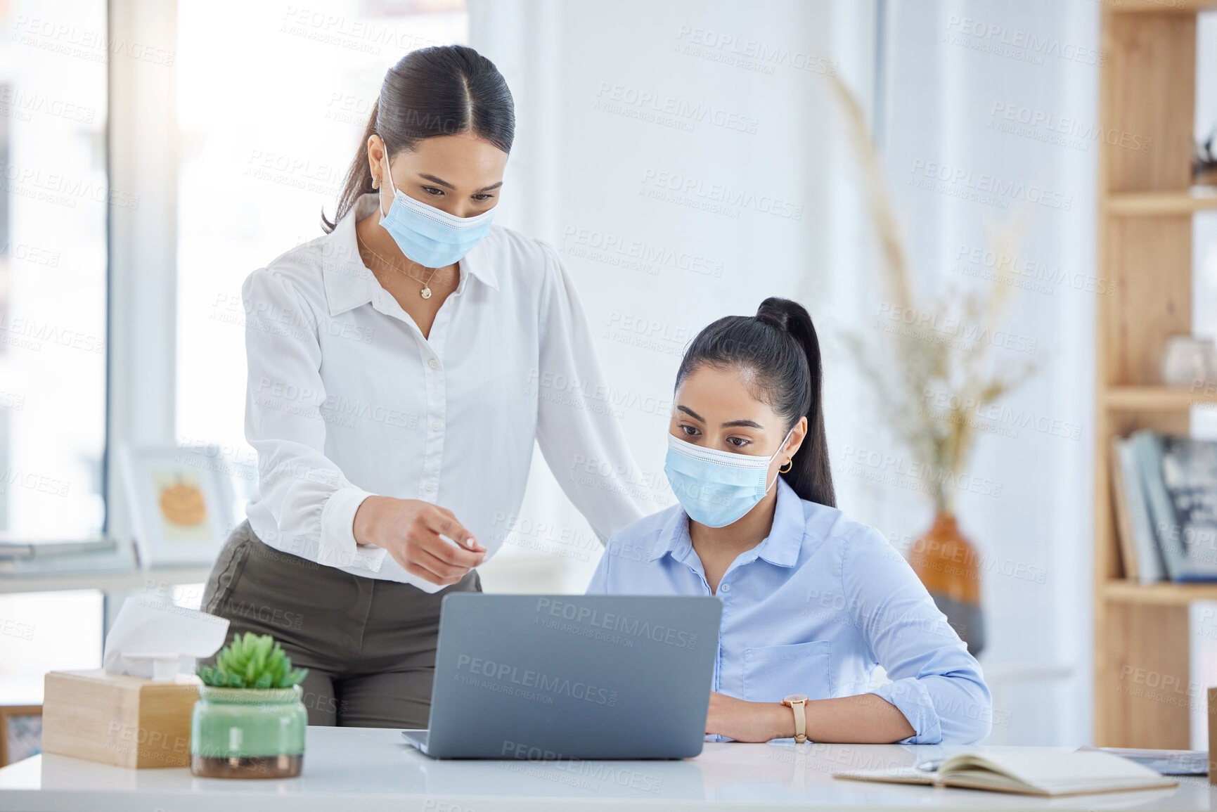Buy stock photo Covid, training and employees talking with laptop in an office together at work. Corporate workers speaking about strategy for business, reading email and working on a proposal on a pc with face mask