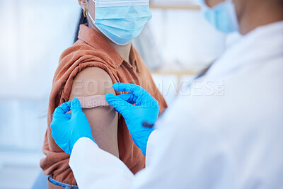 Buy stock photo Medical doctor or nurse with plaster for covid vaccine injection on arm. Zoom in woman patient with mask treatment for disease or flu shot while working in hospital or clinic with healthcare expert