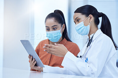 Buy stock photo Covid, consulting and patient, doctor and tablet with results, diagnosis and online medical report. Healthcare, covid 19 and women in doctors office with face mask, digital tech and analysis