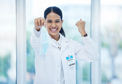 Buy stock photo Doctor, happy and celebration with mask off face for end of covid 19, pandemic and coronavirus. Woman, medic and smile in hospital, clinic or healthcare cheering for stop of virus, bacteria or germs