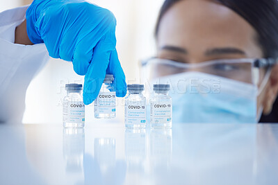 Buy stock photo Covid, vaccine and hands of doctor with bottle of liquid while working at a hospital. Medical nurse, worker and surgeon with healthcare medicine for safety from virus with a face mask at a clinic