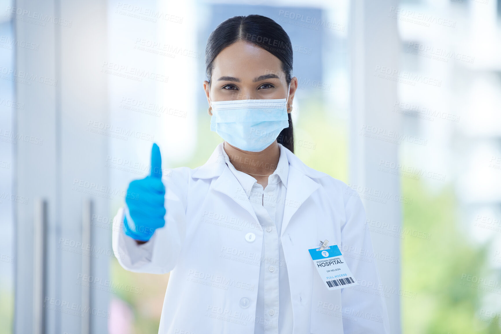 Buy stock photo Doctor, mask and thumbs up at work in hospital, clinic or office for success in healthcare. Medic, woman and professional in medical ppe do hand sign to agree in health, medicine and community safety