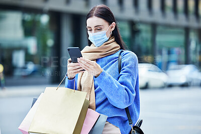 Buy stock photo Woman, shopping in covid mask with smartphone, communication about sale or discount at retail mall. Young shopper in pandemic, bags and contact car service for travel and buyer with urban background.
