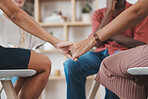 Support, trust and women holding hands at counseling session at addiction treatment clinic. Empathy, compassion and closeup of friends in unity during grief, loss or mental health therapy discussion.