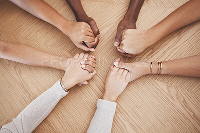 Buy stock photo Diversity, people holding hands and support for trust and relationship for unity, commitment and community. Group of diverse hand in teamwork collaboration and multiracial respect on a wooden table