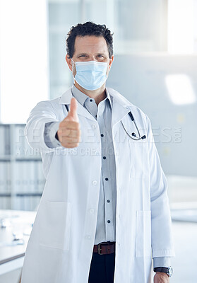 Buy stock photo Covid, success and thumbs up with doctor in hospital for medical support, thank you and goals safety. Trust, innovation and agreement with portrait of a healthcare professional with face mask  
