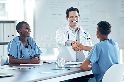 Buy stock photo Handshake, meeting and doctor shaking hands with nurse to welcome him on the job after a promotion in a hospital. Healthcare worker saying thank you to a medical expert for helping in surgery success