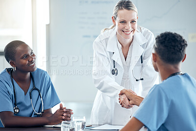 Buy stock photo Team of doctors, handshake and meeting on success, collaboration or promotion at a medical clinic. Happy, teamwork and professional healthcare workers shaking hands in hospital conference room.