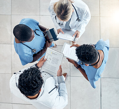 Buy stock photo Doctor, documents and tablet in collaboration above for diagnosis and medical research at the hospital. Healthcare professionals working with technology, data and paperwork in teamwork at a clinic