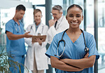 Doctor, portrait or black woman nurse with vision, motivation or leadership in hospital with team. Happy medical healthcare, wellness worker with smile at work for insurance, medicine success clinic