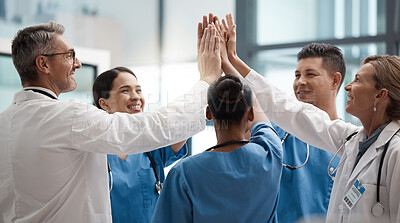 Buy stock photo Hands, high five and collaboration with a team of a doctor, nurse and health professional working in the hospital. Teamwork, motivation and support with a medical group at work in a clinic for care