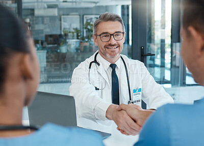Buy stock photo Handshake, nurse and doctor shaking hands after success in a medical surgery at a trustworthy hospital. Partnership, collaboration and physician welcomes a healthcare worker to the team in a meeting