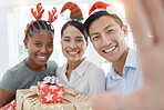 Selfie, gift and friends in christmas celebration, cheerful, smile and relax while giving present and bond together. Diversity, party and people gathering for event photo, happy, excited festive fun