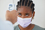 Face mask, thermometer and covid with doctor, medical expert and healthcare worker in clinic, hospital or wellness center. Black woman or patient with medical checking fever to prevent disease