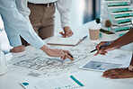 Architect, hands and planning building on paper for construction design or layout at the office. Group hand of employee in teamwork project plan for architecture working on model build or blueprint