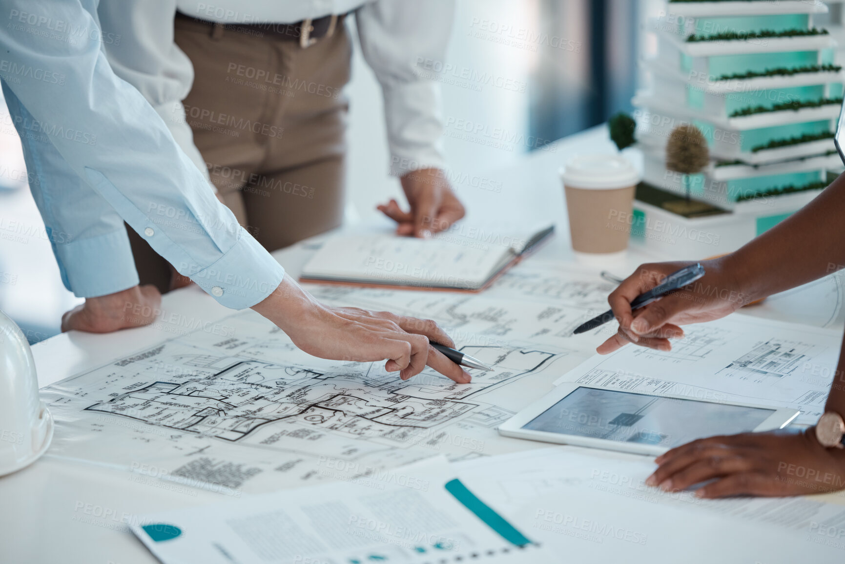 Buy stock photo Architect, hands and planning building on paper for construction design or layout at the office. Group hand of employee in teamwork project plan for architecture working on model build or blueprint