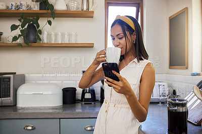 Buy stock photo Drinking coffee, phone and black woman in a home kitchen on a relax morning using technology. Mobile, texting and social media app scroll of a person from Spain in a house watching a web video