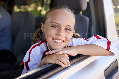 Buy stock photo Happy, little girl and portrait smile for road trip in relax after soccer match in the car. Excited female teenager smiling in happiness for sports vacation, travel or training for football game