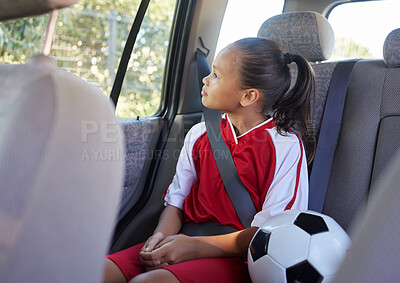 Buy stock photo Child in car interior, travel transport to football and soccer athlete sitting in motor vehicle. Young sports athlete in Brazil fitness training, journey to game in back seat and kid safety seat belt